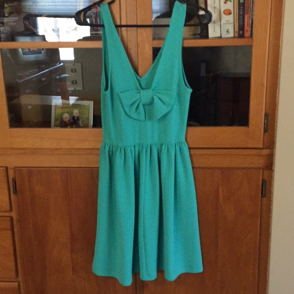 Everly textures teal dress with bow back accent